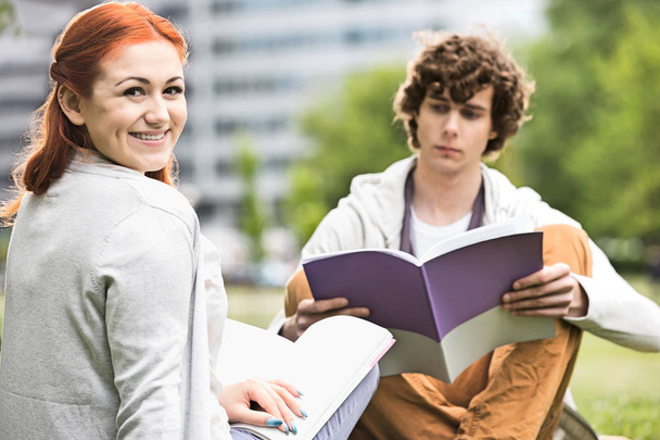 Young woman with male friend studying  - Foto, imagen