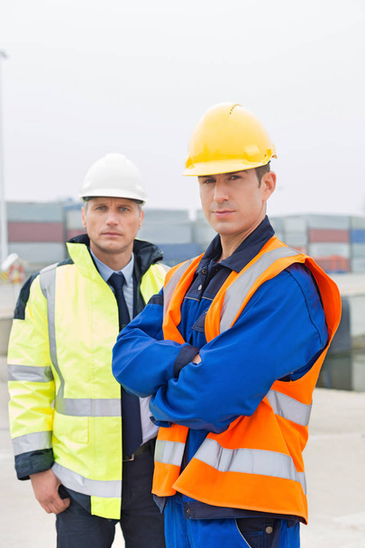 Confident worker standing with coworker - Fotó, kép