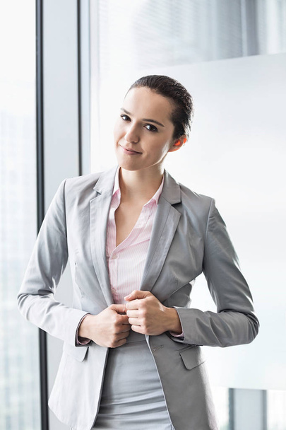 confident young businesswoman in office - Fotó, kép
