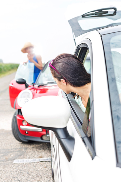 female crashing car on road - Foto, Imagen