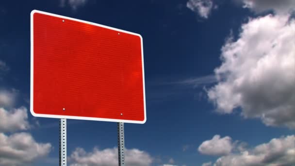 A red blank road sign with time lapse clouds. - Footage, Video
