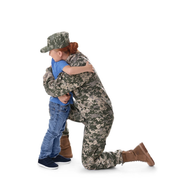 Woman soldier embracing with son  - Foto, afbeelding
