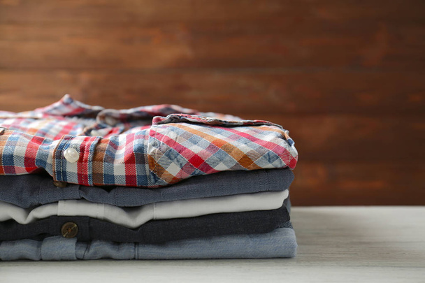 Stack of colorful shirts - 写真・画像