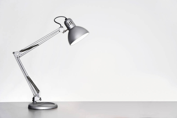Desk lamp on table  - Foto, Imagen
