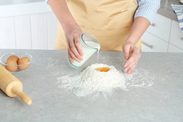 Female hands preparing dough - Фото, изображение
