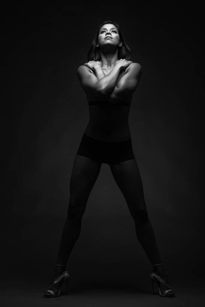 Fitness Model Dancer in black maillot
  - Фото, изображение
