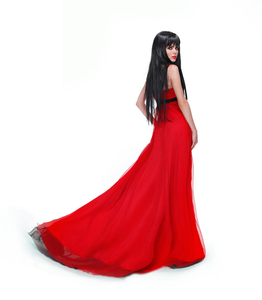 Elegant brunette girl posing in red gorgeous dress isolated on w - Fotoğraf, Görsel