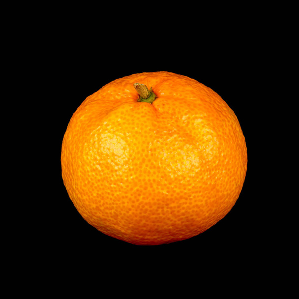Mandarin close-up on a black background. - Фото, зображення