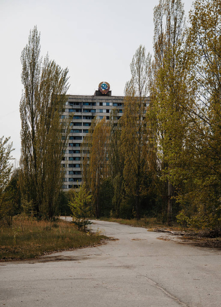 Soviet emblem at building on abadoned town Chernobyl, Ukraine. - Foto, Imagen