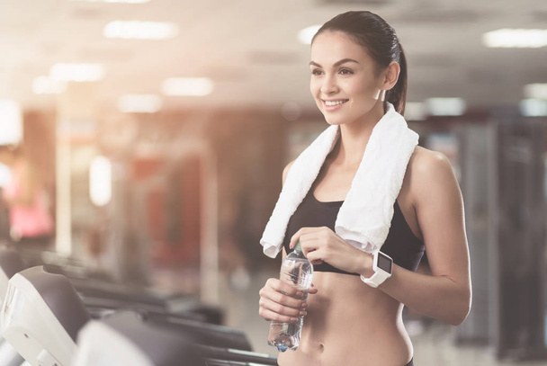 Overjoyed woman wearing a towel after workout - Photo, image