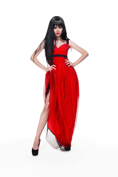 白で隔離される赤いドレスを着て美しい若い女性 - 写真・画像