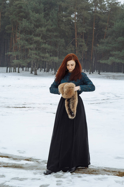 girl in the winter forest - Fotó, kép