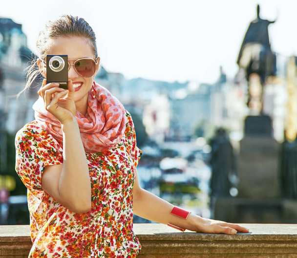 tourist woman with digital camera taking photo in Prague - Φωτογραφία, εικόνα