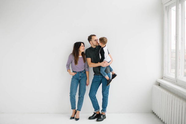 Hipster father, mother holding baby boy over white isolated background - Foto, Imagem