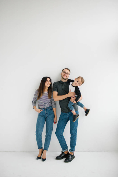 Hipster father, mother holding baby boy over white isolated background - Fotoğraf, Görsel