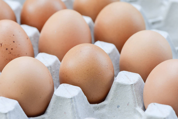 Eggs in paper tray - Фото, изображение