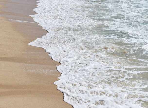 Waves breaking on the beach - 写真・画像