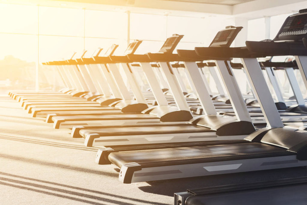 Modern gym interior with equipment, treadmills for fitness cardio training - Photo, Image