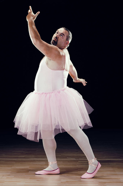 funny fat classical dancer on black background - Valokuva, kuva