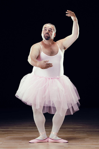 funny fat classical dancer on black background - Фото, изображение
