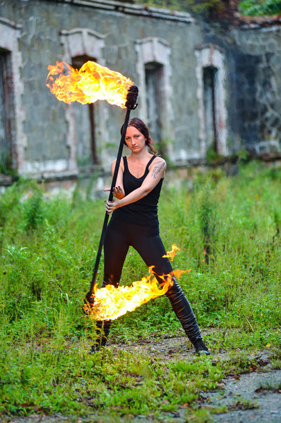 Fire show girl with flaming torches - Photo, Image