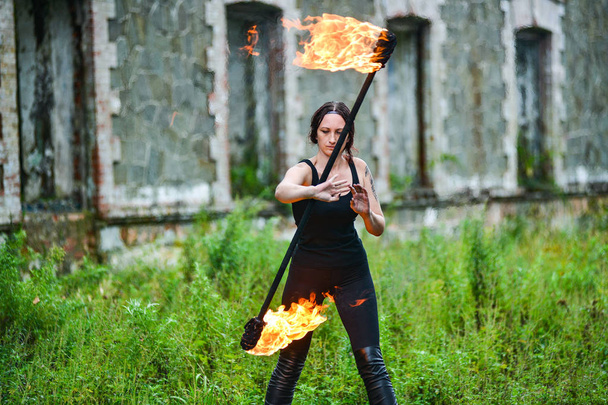 Fire show girl with flaming torches - Photo, Image
