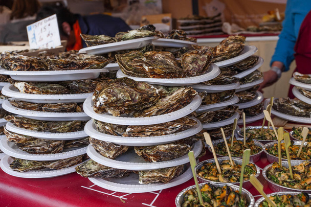 Fresh oysters plate on festival market - Photo, Image