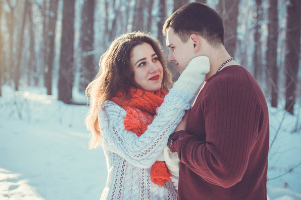 Couple in love in winter forest - Fotoğraf, Görsel
