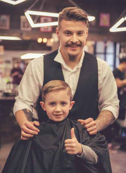 Kid at the barber shop - Фото, изображение