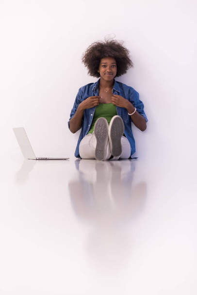 african american woman sitting on floor with laptop - 写真・画像