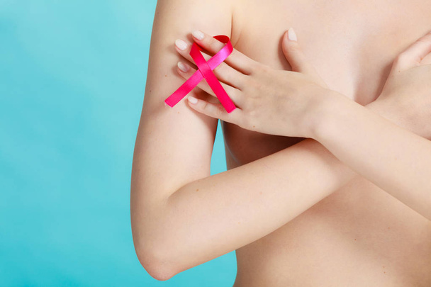 Naked woman with breast cancer awareness ribbon - Photo, Image