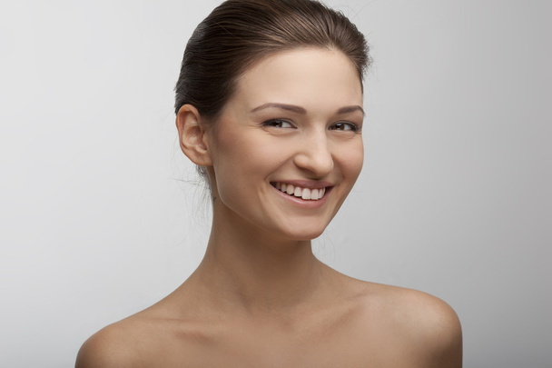 portrait of a beautiful smiling girl with perfect skin - Фото, зображення