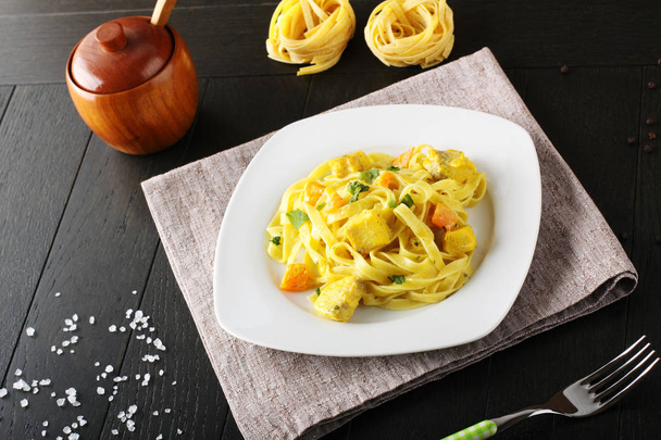 Noodles with swordfish, cream and saffron - Photo, Image