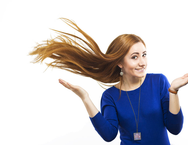 Girl with flying hair.Young smiling girl with long healthy hair. Healthy strong hair. Strong hair. Beautiful slim girl with a haircut. Hair style - Photo, Image
