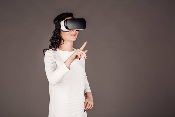 female with glasses of virtual reality. VR headset glasses device. - Foto, afbeelding
