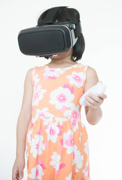 A girl using virtual reality for playing games. - Zdjęcie, obraz