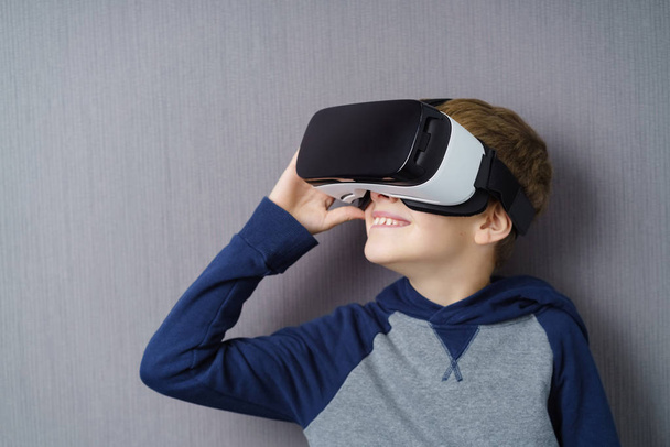 Young boy wearing VR headset - Фото, зображення