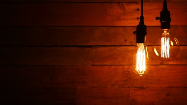 Urban Retro Hanging Light Bulbs on Wood Background - Footage, Video