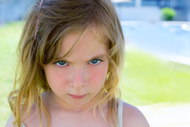 Angry blond children girl portrait looking camera - Photo, image