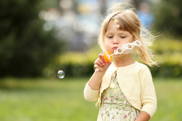 Little girl with soap bubbles - Фото, изображение