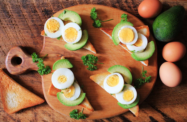 Bruschetta with herbed eggs and avocado - Photo, Image
