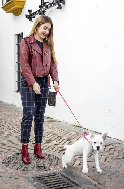 Blond girl with dog - Foto, imagen