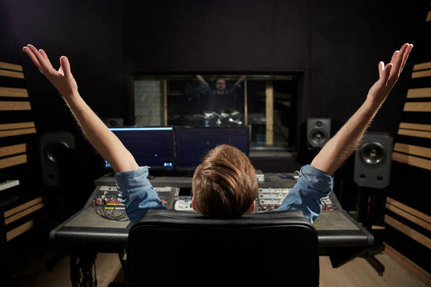 man at mixing console in music recording studio - Foto, Bild