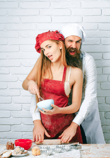 Baker cooking cakes with girl - Foto, Bild