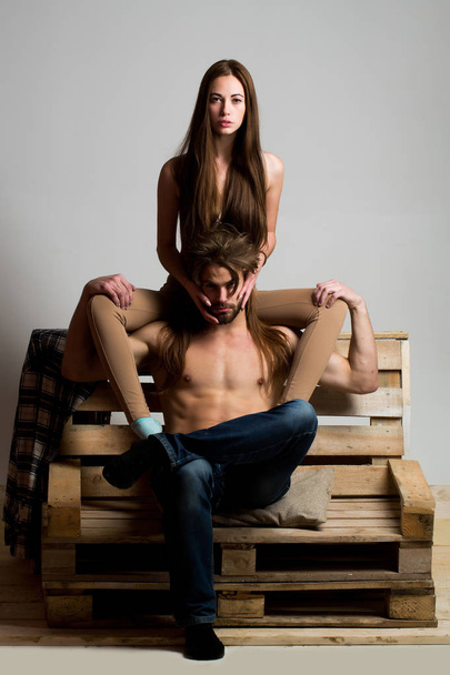 young couple on wooden sofa - Foto, immagini