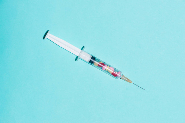 Syringe, medical injection on blue background. - Photo, Image