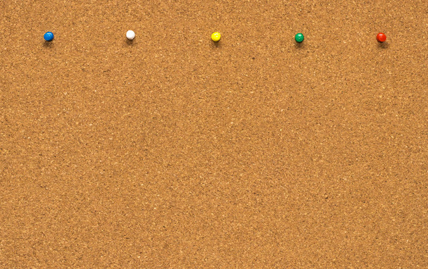 Group of thumbtacks pinned on corkboard - Photo, Image