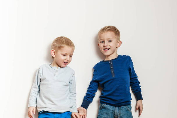 Little boys have fun together at home. - Фото, изображение