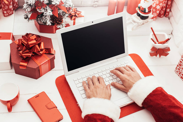 Santa using a laptop - Photo, image