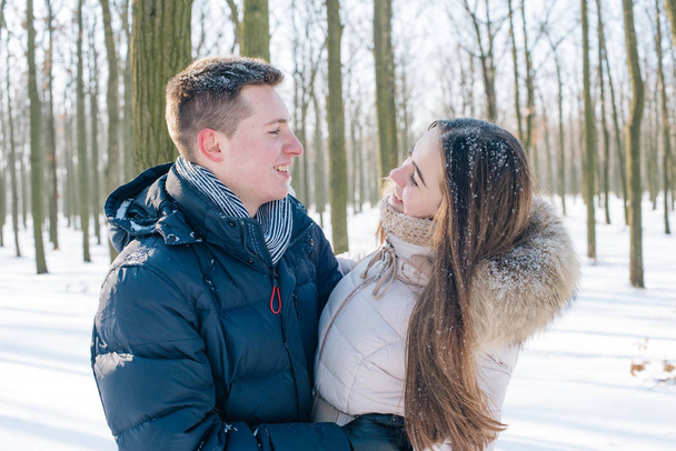 couple having fun in snowy park - Fotó, kép